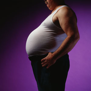 Profile of Man's Beer Belly --- Image by © James W. Porter/Corbis